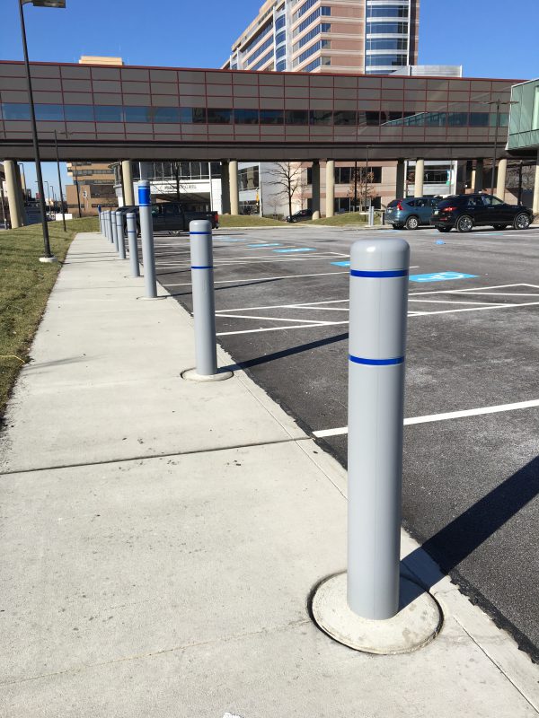 Photo of a grey bollard with blue stripes in Cleveland clinic