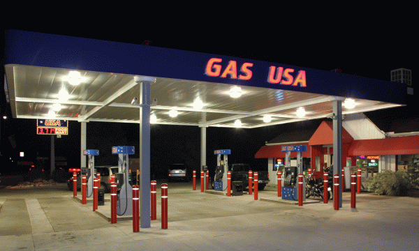 Photo of Gas station with bollards in USA at night